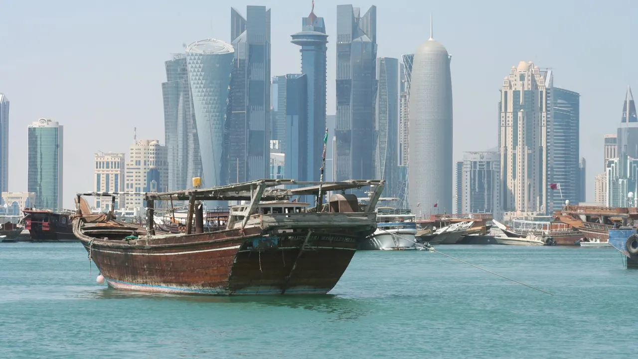 A dhow below the towers of West Bay, Doha