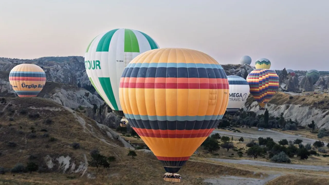 Hot-air balloons over Cappadocia at sunrise, Goreme