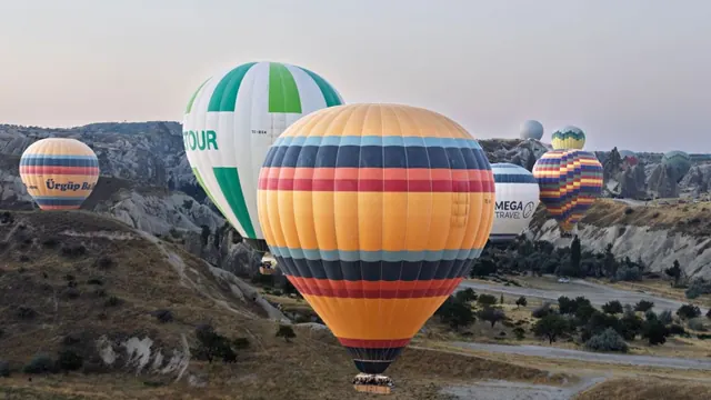 Hot-air balloons over Cappadocia at sunrise, Goreme