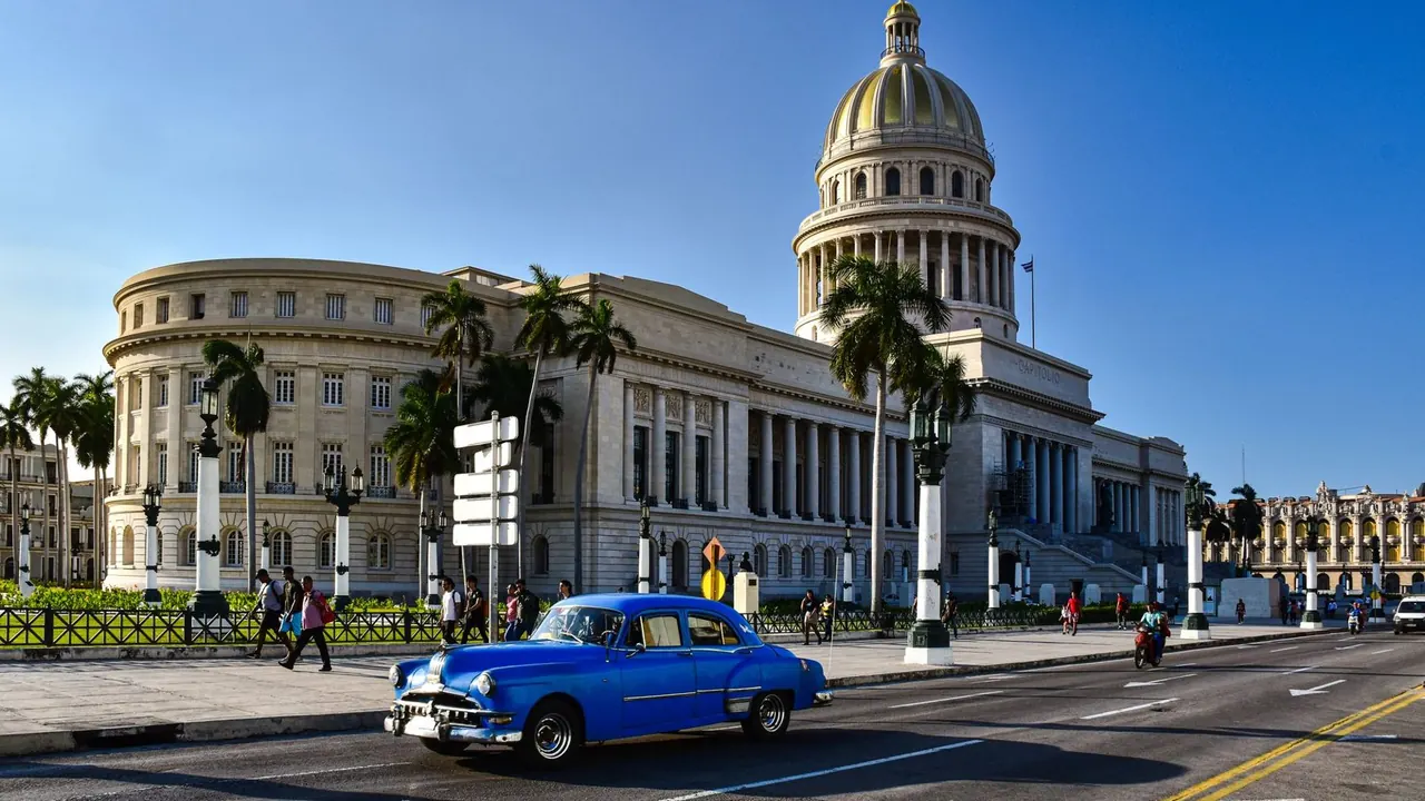 A classic car in front of the Capitolio, Havana