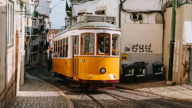 A yellow tram in a narrow street, Lisbon