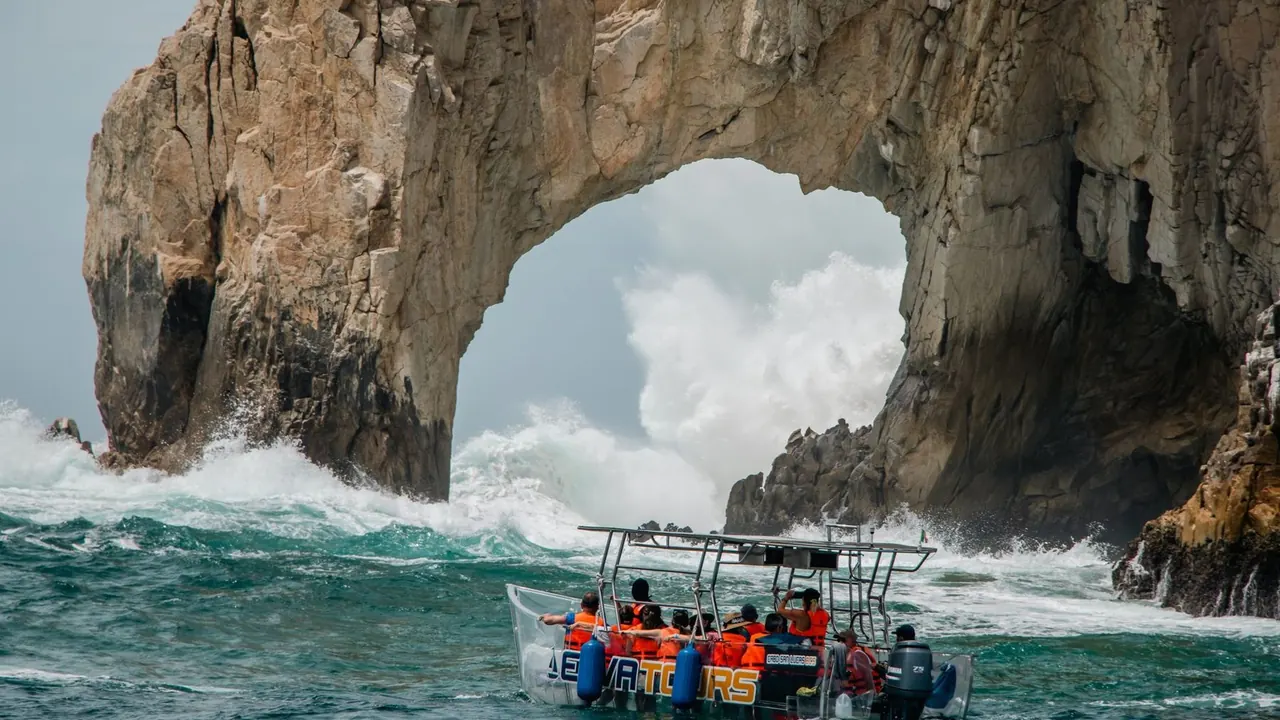 A boat in the swell beside El Arco, Los Cabos