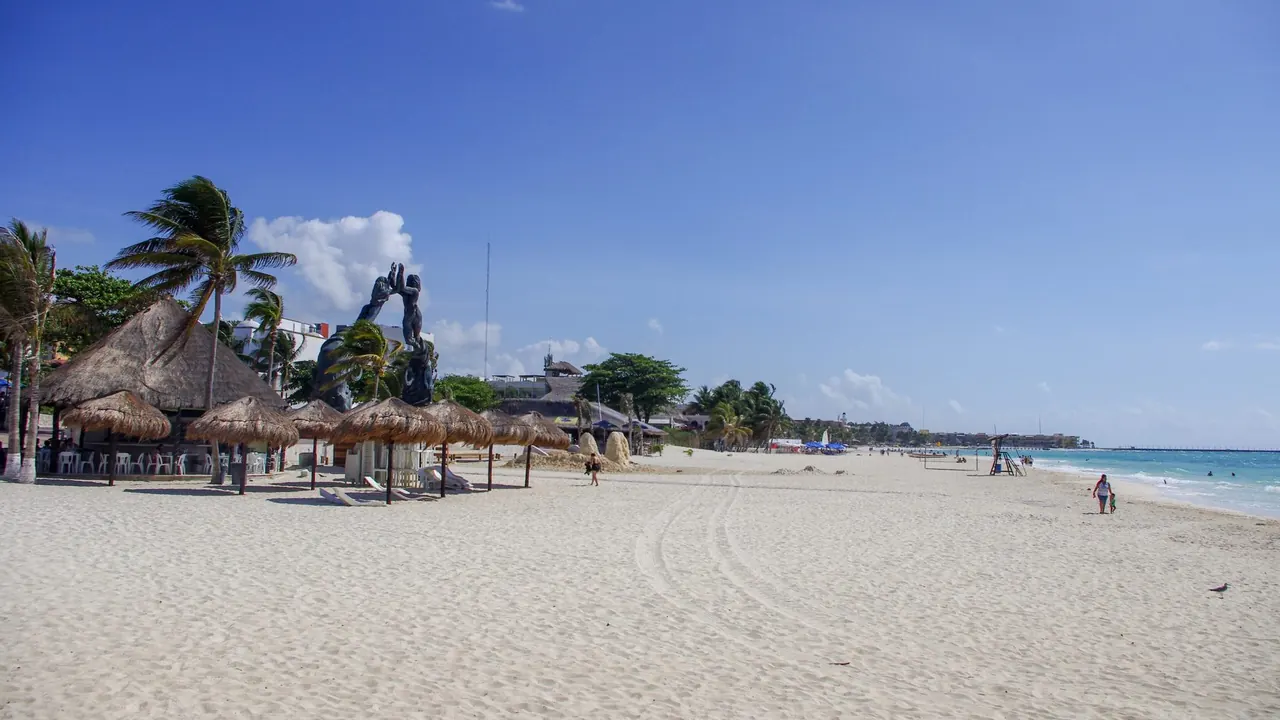 The town beach and the Portal Maya sculpture, Playa del Carmen